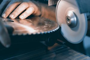 saw blade being sharpened